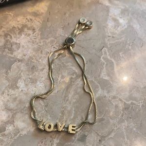Goldtone Bracelet spelling out LOVE Adjustable